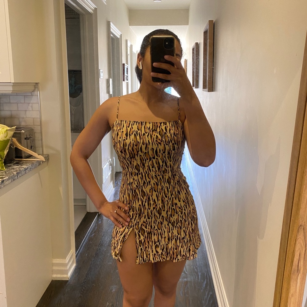Sunday best cheeta print mini dress with leg slit.